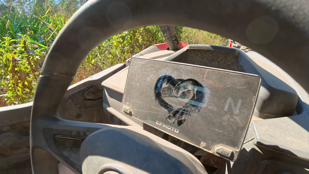 A heart drawn in the dust on the dashboard