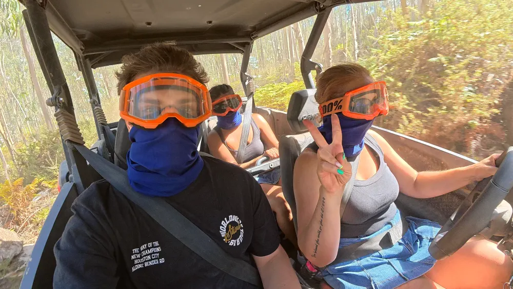 Peace sign from the driver's seat in the eucalyptus forest